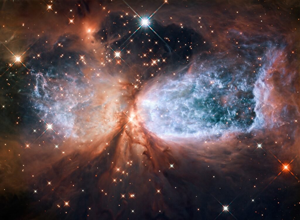 NASA e ESA via Wikimedia Commons, CC BY 4.0, https://commons.wikimedia.org/wiki/File:Star-forming_region_S106_(captured_by_the_Hubble_Space_Telescope).jpg